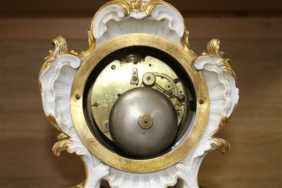 A 19th century French Ed Honore of Paris porcelain three piece clock garniture, clock 34cm, vases 23cm